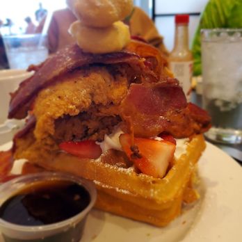 Maple Leaf Diner - Chicken and waffles topped with strawberries, bacon and puff pastry - American Near Me - Dallas, Texas