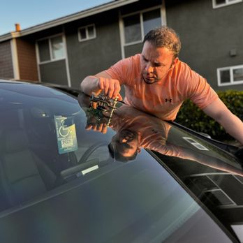 Skylite Auto Glass - Skylite Autoglass master technician at work repairing windshield chips - Auto Glass Services Near Me Skylite Auto Glass - Skylite Autoglass master technician at work repairing windshield chips - Auto Glass Services Near Me