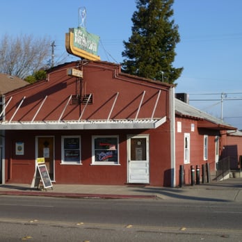 Buckhorn - a red building with a sign on top - Bars Near Me - Petaluma, California
