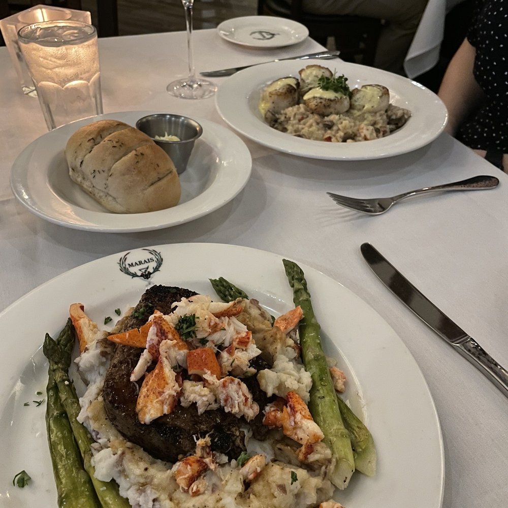Marais - 8 oz sirloin with lobster and the other plate was bay scallops on risotto - Seafood Near Me - Dickinson, Texas Marais - 8 oz sirloin with lobster and the other plate was bay scallops on risotto - Seafood Near Me - Dickinson, Texas