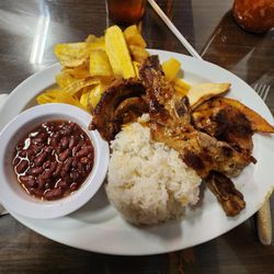 Las Segovias Nicaraguan Restaurant - Costillas de cerdo frito - pork ribs with red beans and rice, fried plantains, plantain chips, fried cheese