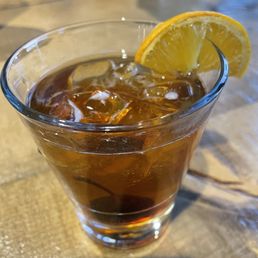 a glass of iced tea with a slice of lemon a glass of iced tea with a slice of lemon
