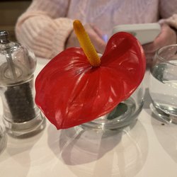 The Lobster Pot Restaurant - Table flower in water