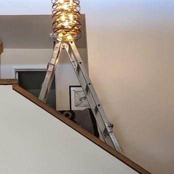 Voltz Electric - Pendant being installed over the staircase - Electricians Near Me Voltz Electric - Pendant being installed over the staircase - Electricians Near Me