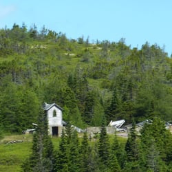 Rugged Beauty Boat Tour - A resettled community seen from the cove