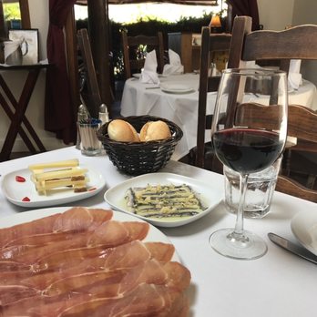 Costa Brava - Jamón serrano, queso manchego (cheese), anchovies and a glass of Carlos Serres Rioja wine. - Tapas Bars Near Me - San Diego, California Costa Brava - Jamón serrano, queso manchego (cheese), anchovies and a glass of Carlos Serres Rioja wine. - Tapas Bars Near Me - San Diego, California