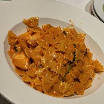 Mezza Luna Restaurant - Farfalle Salmone - bow tie pasta + salmon chunks + light vodka, tomato, cream sauce - Italian Near Me - Half Moon Bay, California