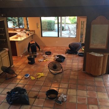 California Tile Restoration - Here are the guys on hands and knees cleaning each tile with a brush. - Tiling Near Me California Tile Restoration - Here are the guys on hands and knees cleaning each tile with a brush. - Tiling Near Me