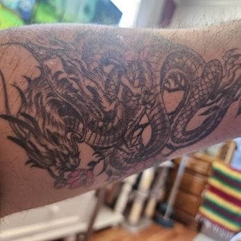 ARTillery Ink Temecula - Picture doesn't do it justice! Serpent Dragon with Pink peonies. - Tattoo Near Me - Temecula, California ARTillery Ink Temecula - Picture doesn't do it justice! Serpent Dragon with Pink peonies. - Tattoo Near Me - Temecula, California