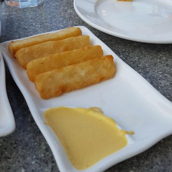 Puerto 27 Peruvian Kitchen & Pisco Bar - fried yuccas love the sauce......the plantains need a dipping sauce : ) - Peruvian Near Me - Pacifica, California Puerto 27 Peruvian Kitchen & Pisco Bar - fried yuccas love the sauce......the plantains need a dipping sauce : ) - Peruvian Near Me - Pacifica, California