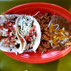 Fred's Mexican Cafe - Kalua pork tacos.. Mexican rice and yummy refried beans