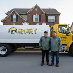 Remedy Septic - Gabe and Mike posing with one of our pump truck
