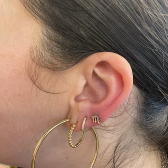 Live by the Sword Tattoo - Fresh fourth lobe piercing - LOVED the zodiac selection! - Piercing Near Me - Brooklyn, New York Live by the Sword Tattoo - Fresh fourth lobe piercing - LOVED the zodiac selection! - Piercing Near Me - Brooklyn, New York