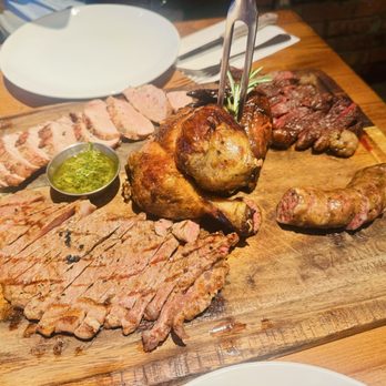 Carnicero Steakhouse - Carnicero board with PICANHA, 1/2 ROASTED CHICKEN, GRILLED CHORIZO, PORK TENDERLOIN. - Steakhouses Near Me - Miami, Florida Carnicero Steakhouse - Carnicero board with PICANHA, 1/2 ROASTED CHICKEN, GRILLED CHORIZO, PORK TENDERLOIN. - Steakhouses Near Me - Miami, Florida