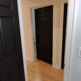 F. Soto Construction - a hallway with a black door - Windows Installation Near Me - Chicago, Illinois