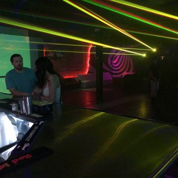 1 Up - a man and a woman at a dj booth - Bars Near Me - Reno, Nevada