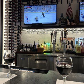 Marino's - a glass of wine on a bar - Pizza Near Me - Miami, Florida Marino's - a glass of wine on a bar - Pizza Near Me - Miami, Florida