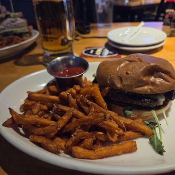 Twin Peaks - Avocado smash burger with sweet potatoe fries - New American Near Me - Columbus, Ohio Twin Peaks - Avocado smash burger with sweet potatoe fries - New American Near Me - Columbus, Ohio