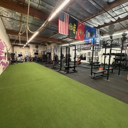 Iron Warehouse - Updated powerlifting area. 3 deadlift platforms, 2 rogue combo racks, ER combo rack
