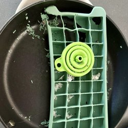 Lock-N-Key - Previously clean ice cube tray and frying pan, chewed and scratched by rats.