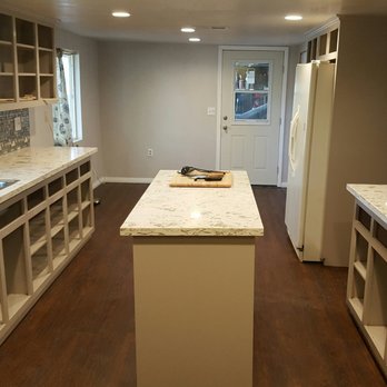 Rialto Flooring - a kitchen with a sink and stove - Flooring Near Me - redlands, California Rialto Flooring - a kitchen with a sink and stove - Flooring Near Me - redlands, California