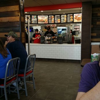 Arby's - a man sitting at a table in a fast food restaurant - Fast Food Near Me - Harrisonville, Missouri Arby's - a man sitting at a table in a fast food restaurant - Fast Food Near Me - Harrisonville, Missouri