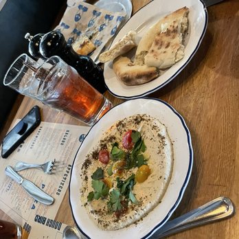 Doughbird - Hummus with fresh garden tomatoes and homemade pizza bread as your pita bread! Melted in your mouth! - Comfort Food Near Me - Phoenix, Arizona