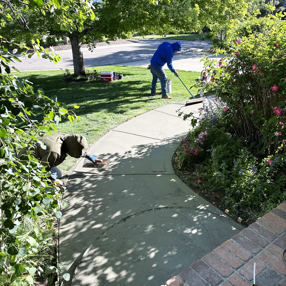 Masonry Restoration - Raking the new concrete sidewalk so it matches the rest of my sidewalk. - Stucco Services Near Me - Aurora, Colorado