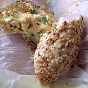 Moe's Broadway Bagel - Half Eaten Italian bagel with Veggie Cream Cheese - Bagels Near Me - Boulder, Colorado Moe's Broadway Bagel - Half Eaten Italian bagel with Veggie Cream Cheese - Bagels Near Me - Boulder, Colorado