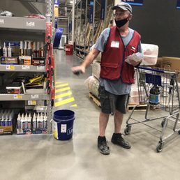 Employee Scott is wearing his mask so low that when he speaks it does not cover his mouth and it never covers his nose. Employee Scott is wearing his mask so low that when he speaks it does not cover his mouth and it never covers his nose.