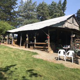 a barn with tables and chairs
