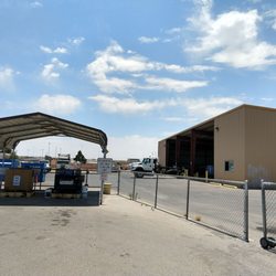 South Central Solid Waste Authority - Paint & household chemicals. Behind are cardboard bins with slots for flattened boxes.