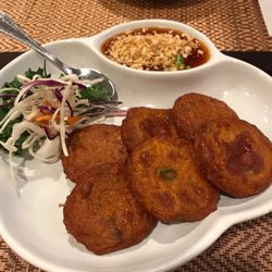 Talay Thai - Tod Mun Pla: Fried fish cake served with sweet chili sauce , chopped cucumber & peanut.