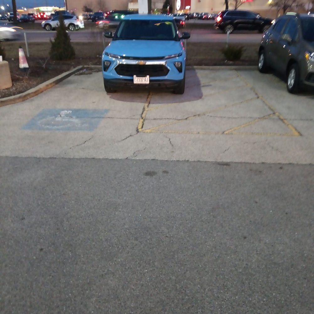 A dealer vehicle taking up a handicapped parking.as I have no toes and needed to park in there fueling spot. A dealer vehicle taking up a handicapped parking.as I have no toes and needed to park in there fueling spot.