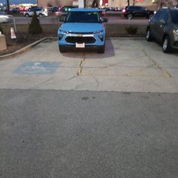 A dealer vehicle taking up a handicapped parking.as I have no toes and needed to park in there fueling spot.