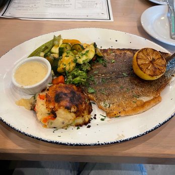 Lure Fish House - Whole roasted Branzino with Potato Parmesan cake and roasted vegetables - Seafood Near Me - Porter Ranch, California