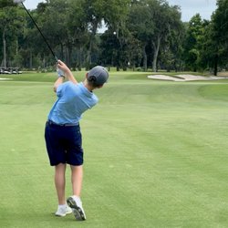 The Golf Club at Indigo Run - Youth hitting a fairway wood on the 18th at Indigo Run.