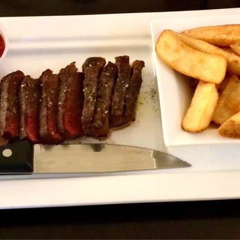 The Foxhole Restaurant And Bar - Flat iron steak with garlic butter and fries - American Near Me - Fort Mill, South Carolina The Foxhole Restaurant And Bar - Flat iron steak with garlic butter and fries - American Near Me - Fort Mill, South Carolina