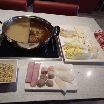 Hot Pot Delight - From left to right Ramen, Spam/Ham, meatballs, shrimp balls, squid. Assorted veggies. Beef. Traditional bone broth/spicy bone broth - Hot Pot Near Me - Roselle, Illinois Hot Pot Delight - From left to right Ramen, Spam/Ham, meatballs, shrimp balls, squid. Assorted veggies. Beef. Traditional bone broth/spicy bone broth - Hot Pot Near Me - Roselle, Illinois