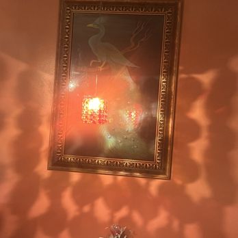 Anarbagh - a vase of flowers in front of a painting - Indian Near Me - Encino, California Anarbagh - a vase of flowers in front of a painting - Indian Near Me - Encino, California