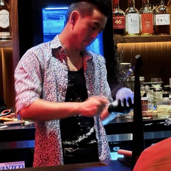 Tokyo Noir - Bartender carving ice - Speakeasies Near Me - Long Beach, California Tokyo Noir - Bartender carving ice - Speakeasies Near Me - Long Beach, California