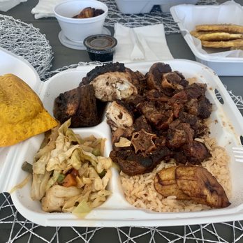 Jerk Dat - Large Oxtail & Jerk Chicken combo. Beef patty to the left - Caribbean Near Me - Las Vegas, Nevada Jerk Dat - Large Oxtail & Jerk Chicken combo. Beef patty to the left - Caribbean Near Me - Las Vegas, Nevada