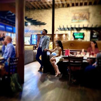 Iguana Cafe - a man and a woman sitting at a table - Creperies Near Me - Chicago, Illinois Iguana Cafe - a man and a woman sitting at a table - Creperies Near Me - Chicago, Illinois