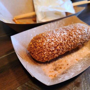 Chung Chun - a donut covered in powdered sugar - Korean Near Me - Laval, Quebec