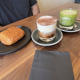 Matcha Cloud Cream, Black & White, and a chocolate croissant Matcha Cloud Cream, Black & White, and a chocolate croissant