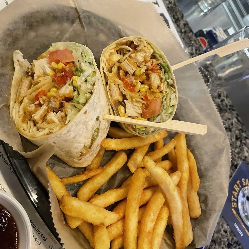 Knights Out Pub & Eatery - Grilled southwest chicken wrap and fries - Pubs Near Me - Orlando, Florida