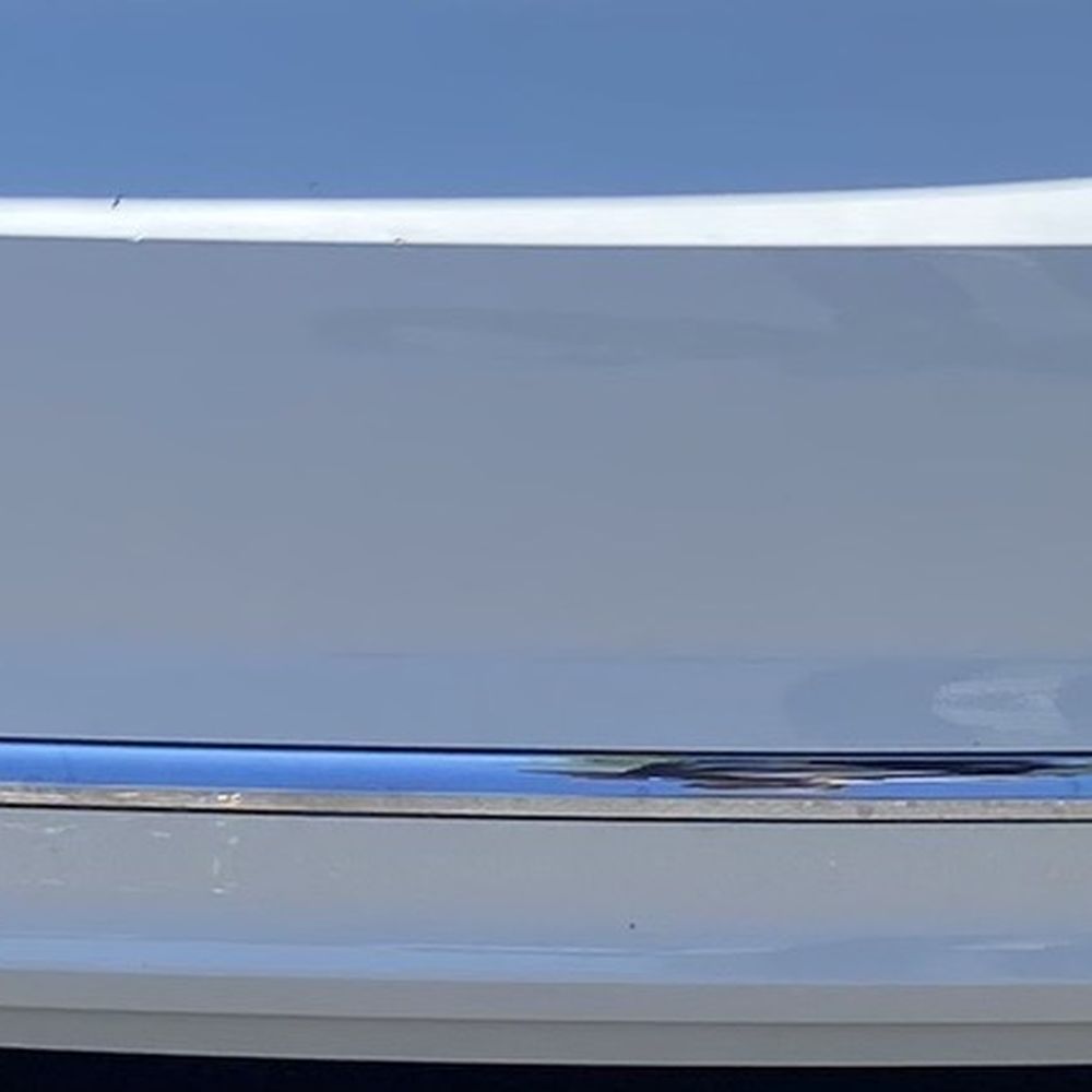 Before. Strong scratches on right side of bumper from shopping cart impact. Before. Strong scratches on right side of bumper from shopping cart impact.