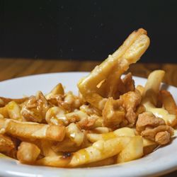 Mama La's Food for the Soul - TOMMMY DID IT (loaded fries with homemade cheese sauce, fried chicken bites and your choice of signature sauce)