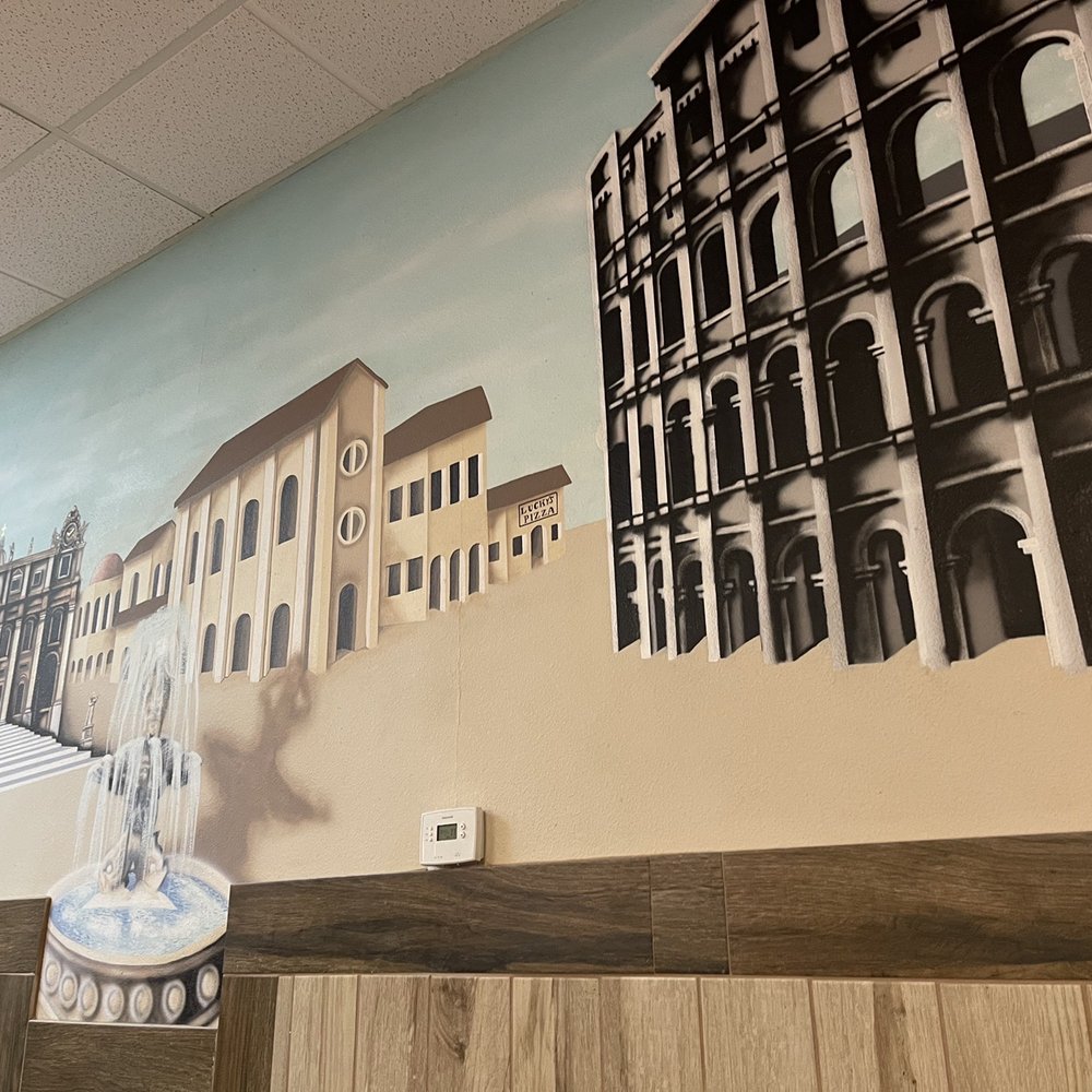 Lucky's Pizza - a mural of buildings and a clock - Pizza Near Me - Surprise, Arizona Lucky's Pizza - a mural of buildings and a clock - Pizza Near Me - Surprise, Arizona