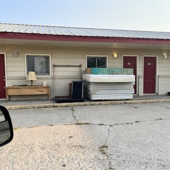 Dreamliner Motel - Furniture stacked outside. - Hotels Near Me - Mankato, Kansas